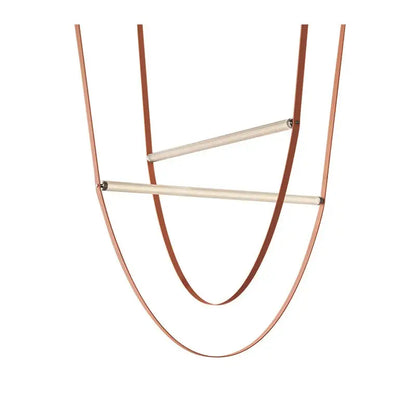 Minimalist copper-toned leather necklace with two horizontal wooden bars paired with decorbites glass tube pendant light