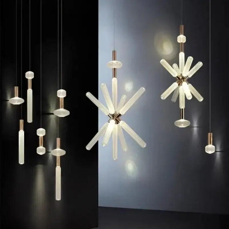 Modern luxury pendant lamp by decorbites featuring frosted glass tubes and brass accents in a starburst design