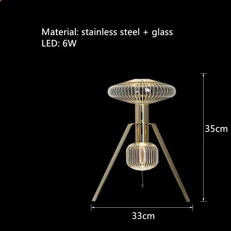Modern tripod table lamp with gold stainless steel frame and intricate wire mesh glass shades in decorbites glass tubes led style
