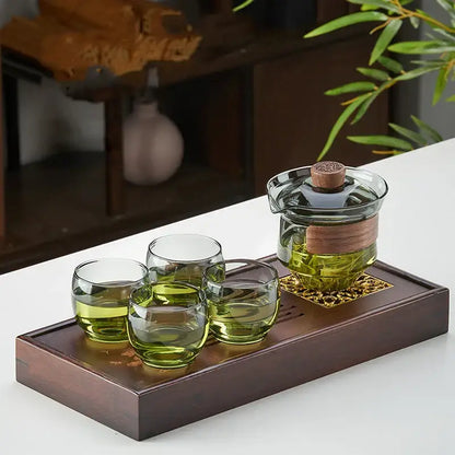 Clear glass decorbites glass tureen tea set with wooden lid and handle and four cups for kung fu tea on dark wood tray