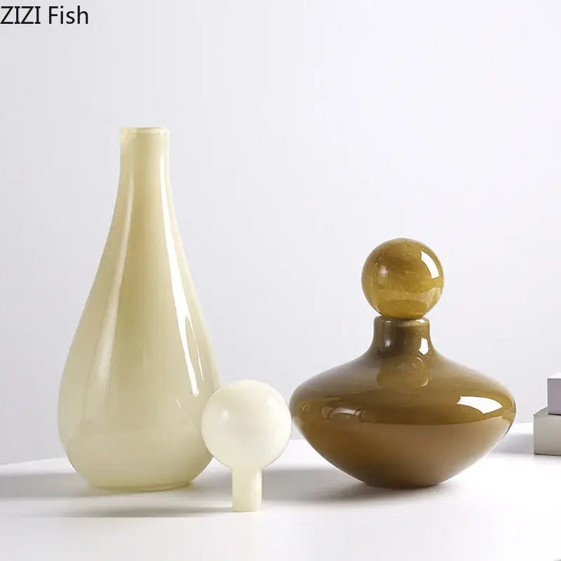 Cream-colored glossy ceramic decorbites glass vase with slender neck and rounded base for vase flower arrangement