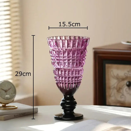 A tall elegant purple decorbites glass vase with black base and geometric cut patterns for hydroponics plant pot