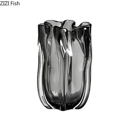 A sleek dark gray decorbites glass vase with wavy sculpted design and vertical ridges for hydroponics desk decor