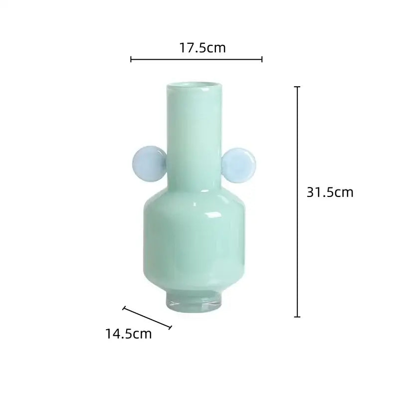 A sleek mint-green decorbites glass vase with light blue spherical handles designed for floral arrangement use