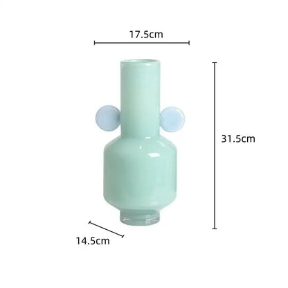A sleek mint-green decorbites glass vase with light blue spherical handles designed for floral arrangement use