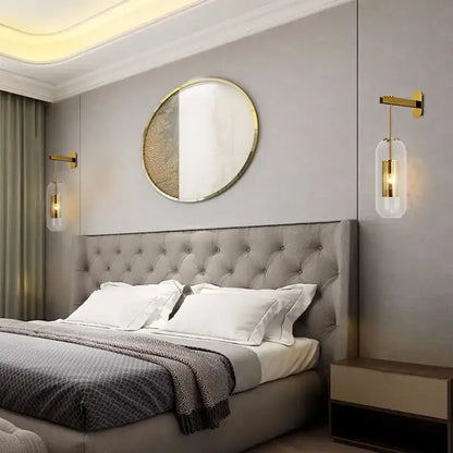 Gray tufted upholstered bed headboard with soft textured surface and subtle button detailing behind glass wall art light