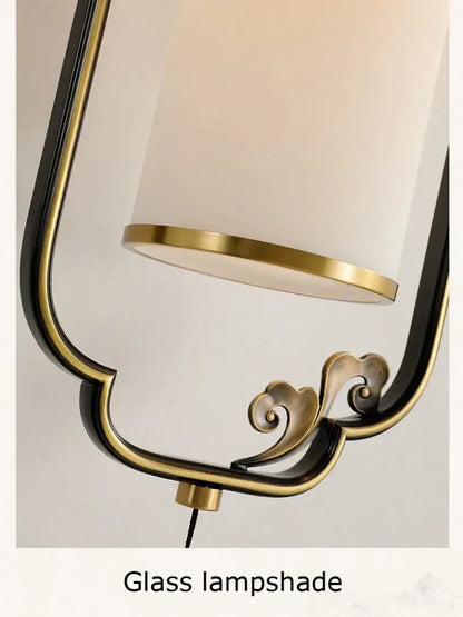 Decorbites glass wall lamp with black and gold metal frame and off-white glass shade for living room and bedroom use
