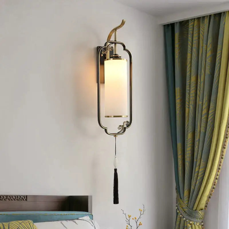 Brass-finished DecorBites glass wall lamp with rectangular frosted glass shade and ornate curved metal frame for living spaces