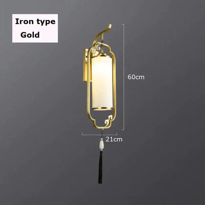 Gold iron DecorBites glass wall lamp with frosted glass cylinder and black tassel for living room and bedroom decor
