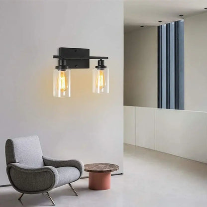 Black metal DecorBites glass wall lamp with two clear glass shades and vintage filament bulbs for modern indoor lighting