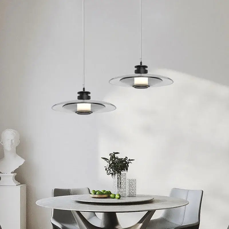 Modern black and clear glass pendant lights with sleek circular designs featured in decorbites glass wall lamp for dining