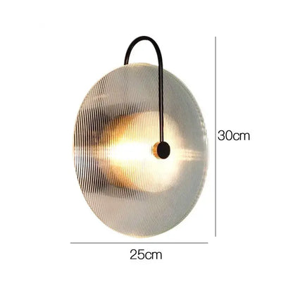 Modern minimalist DecorBites glass wall lamp with frosted ridged glass disc and black curved metal arm for home decor