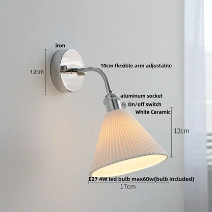 A sleek white ceramic wall light fixture with a fluted conical shade and adjustable chrome arm by decorbites
