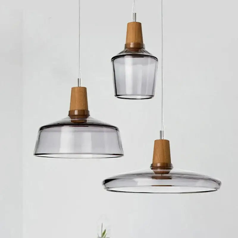Set of three decorbites glass and wood pendant lights with smoked glass shades for modern nordic dining decor