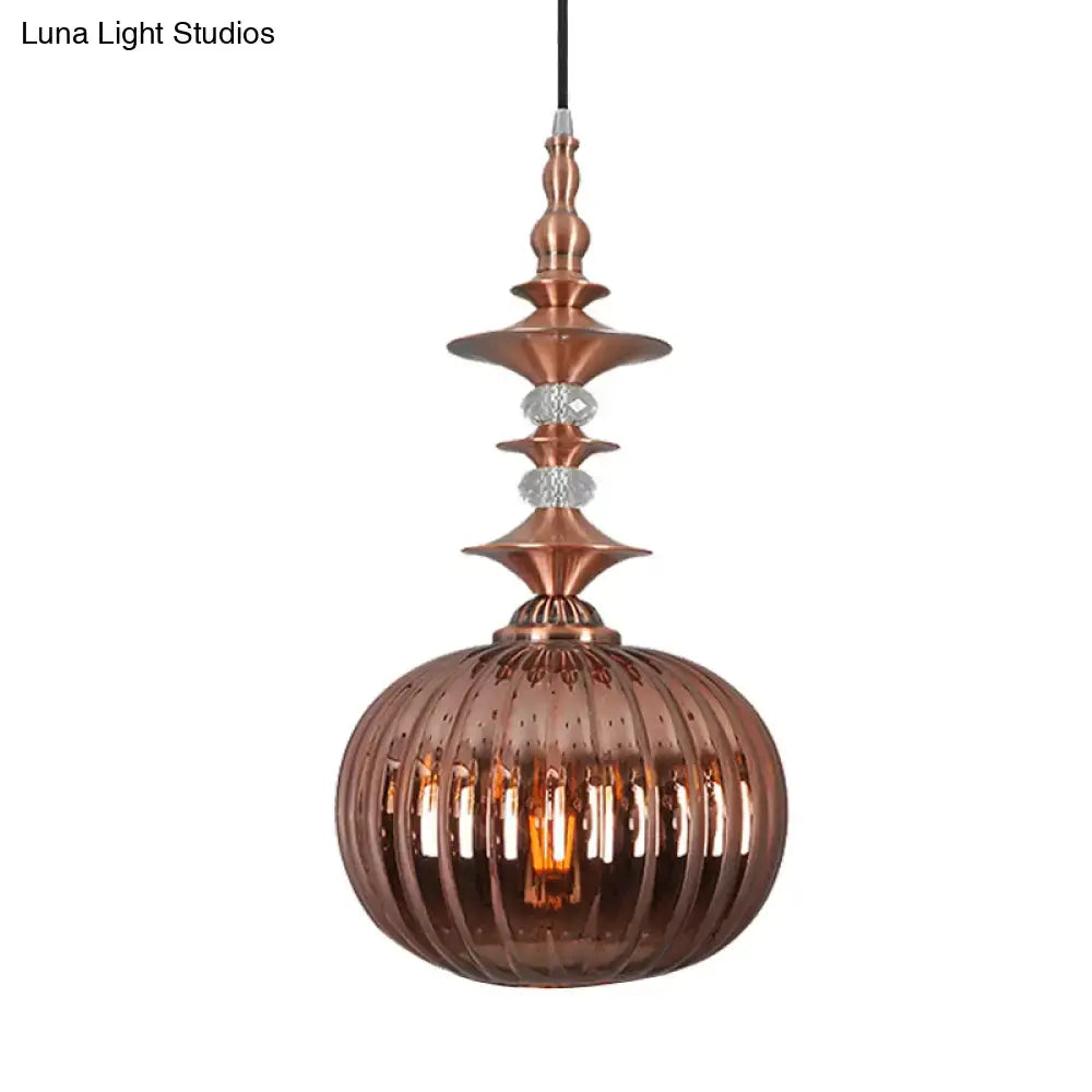 Copper-toned pendant light with ribbed glass globe and crystal accents in chrome copper gold finish for dining room use