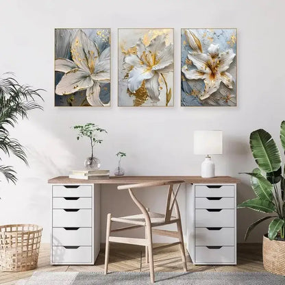Three framed decorbites gold and white floral 3d canvas wall art featuring white flower canvas posters above a wooden desk
