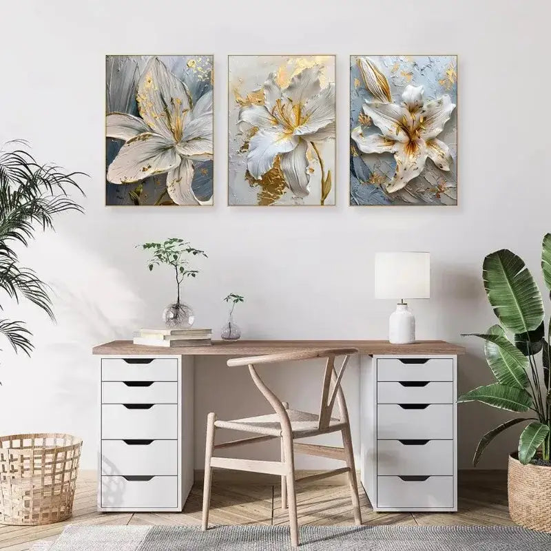 Three framed decorbites gold and white floral 3d canvas wall art featuring white flower canvas posters above a wooden desk