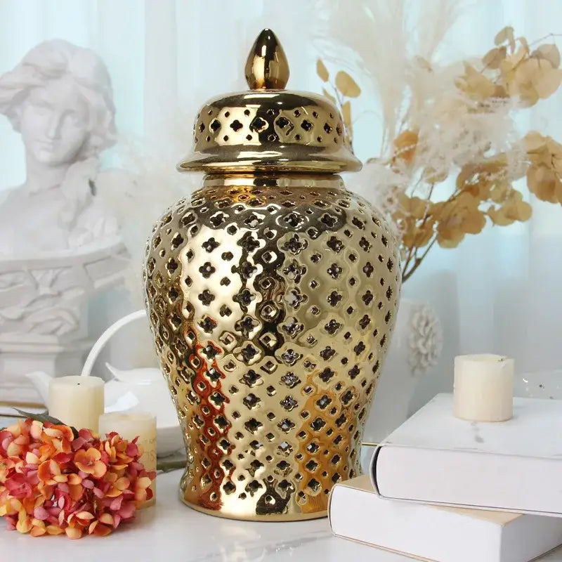 DecorBites gold ceramic carved temple jar with intricate perforated pattern and matching lid for elegant home decor