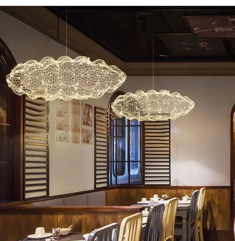 Two gold cloud pendant lights with delicate wire mesh design and warm glow for home and restaurant decorbites