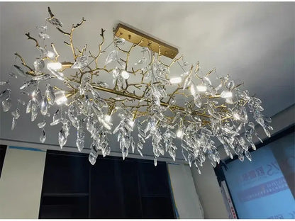 Decorbites gold crystal led chandelier featuring a golden branch design with clear leaf-shaped crystal droplets for home lighting