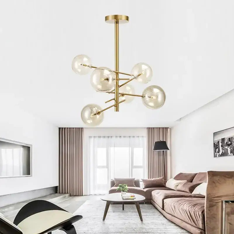 Decorbites gold glass bubble chandelier with gold-toned modern frame and clear glass globes for dining room lighting