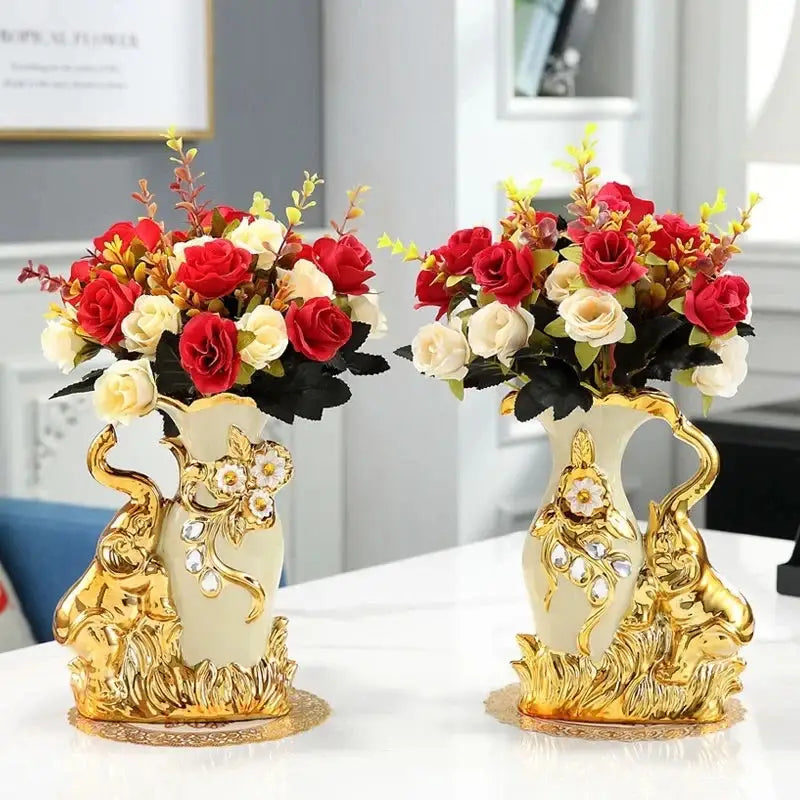Elegant cream ceramic gold glass vase with ornate handles and red white roses for stylish home decor by decorbites