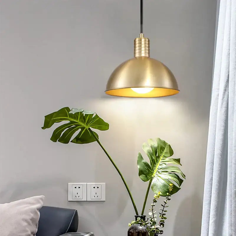 Decorbites gold modern warm brass pendant light with dome-shaped shade and ribbed detailing for dining room use
