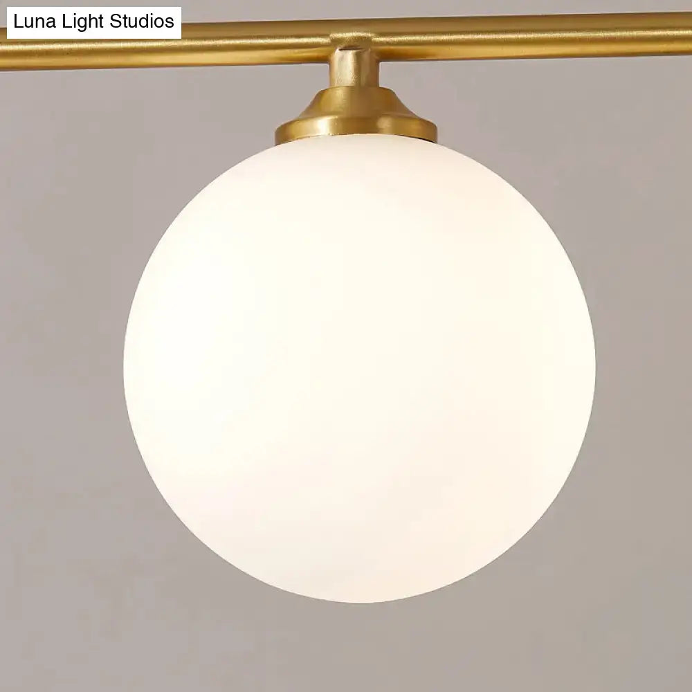 DecorBites gold opaline glass pendant light with frosted white globe shade and polished brass fixture for dining room ceiling light