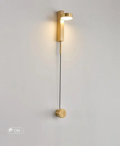 DecorBites gold wall lamp with dimmer switch features a gold-toned minimalist cylindrical wall sconce and illuminated head