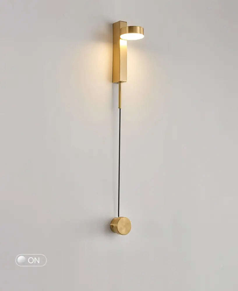 DecorBites gold wall lamp with dimmer switch features a gold-toned minimalist cylindrical wall sconce and illuminated head