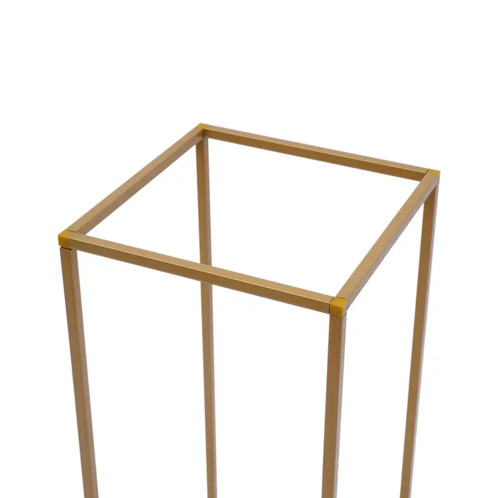 Gold-toned metal flower vase stand with a square frame and slender legs for gold wedding decor by DecorBites™
