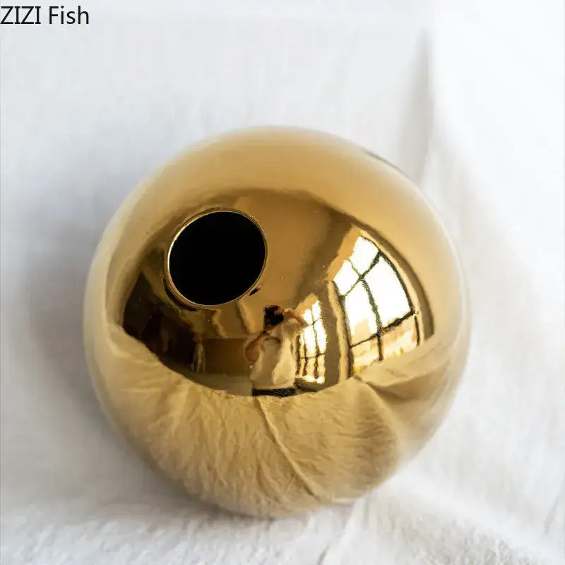 Decorbites™ golden ball ceramic vase with shiny gold reflective surface and circular opening for home decor