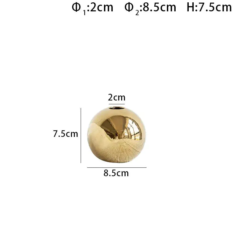 DecorBites™ golden ball ceramic vase is a sleek spherical gold-colored home decor piece with a glossy finish