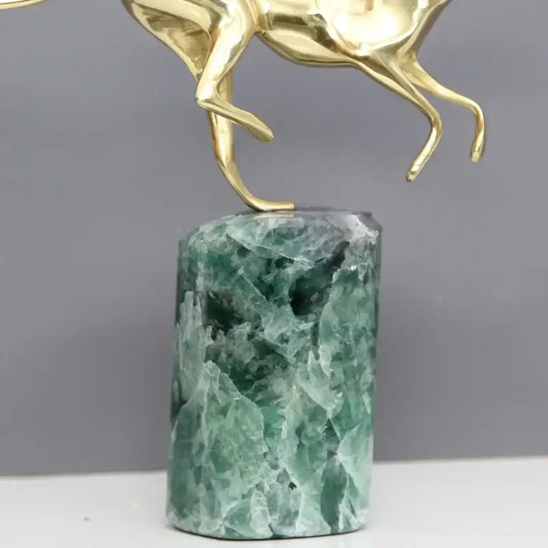 Golden horse figurine with green fluorite base in decorbites golden leopard brass cheetah living room decor collection