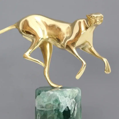 Decorbites golden leopard brass cheetah figurine with sleek golden metallic surface on green stone base for living room decor