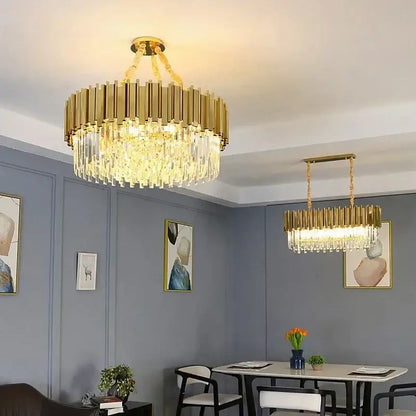 Decorbites golden luxury chandelier featuring gold-toned crystal rods and clear glass prisms for living room elegance