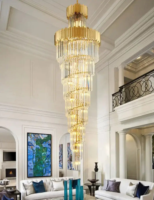 A decorbites golden luxury multi-tiered cascading chandelier with golden frames and crystal prisms for luxury hotel lobby