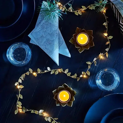 DecorBites golden silver fairy lights with tiny leaves and warm glowing bulbs arranged in a decorative arc for events
