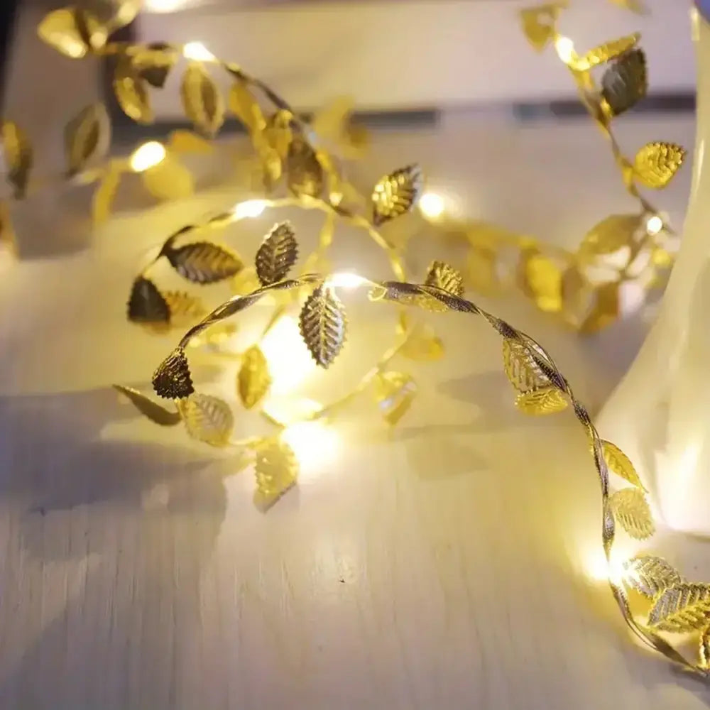 Golden silver decorbites™ fairy lights with warm glowing bulbs shaped like tiny leaves for events and decoration