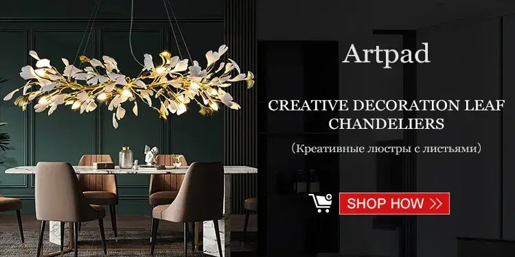 Elegant gold and white leaf-shaped decorbites™ chandelier with intricate branching design and green crystal stone accents
