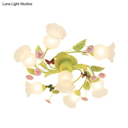 Decorbites green opaque glass spiral ceiling light fixture with pastel green and pink floral chandelier and butterfly accents