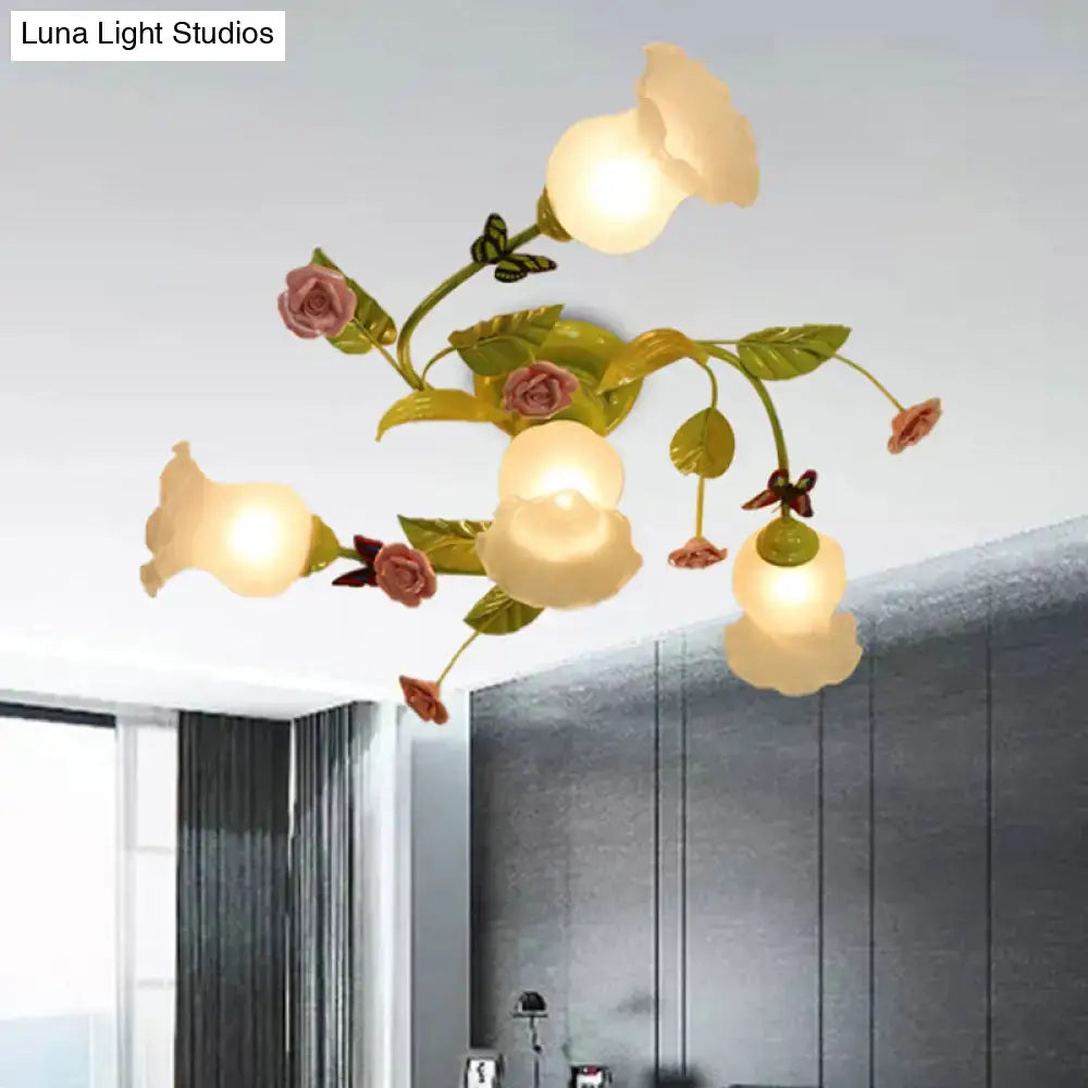 DecorBites™ green opaque glass spiral ceiling light fixture with pink and cream glass blossoms and butterfly accents