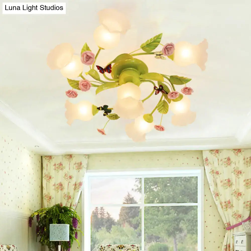 DecorBites green opaque glass spiral ceiling light fixture with pastel pink and green floral petals and butterfly accents