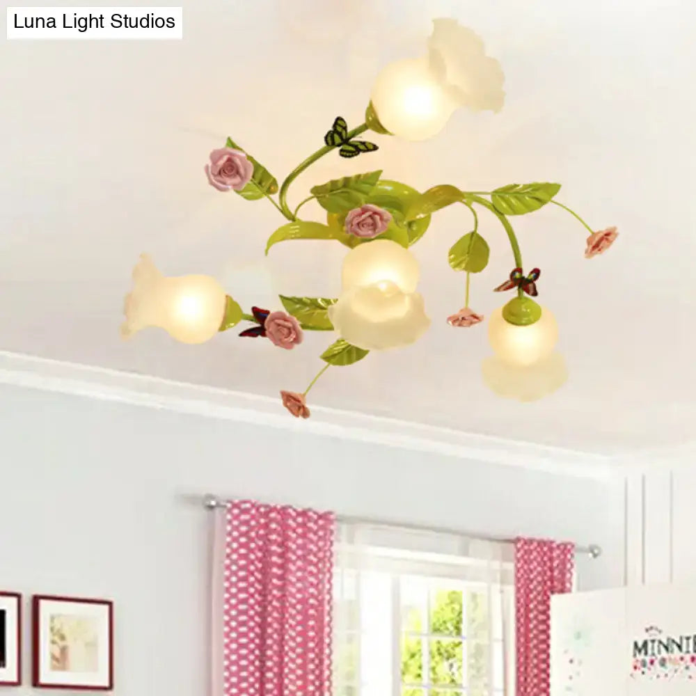 Decorbites green opaque glass spiral ceiling light fixture with pastel pink rose design and painted green stems