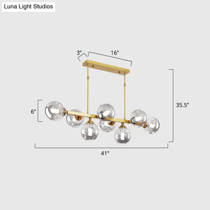 Gold-toned DecorBites™ modern chandelier with hand-blown dimpled glass globe bulbs for restaurant island pendant lamp