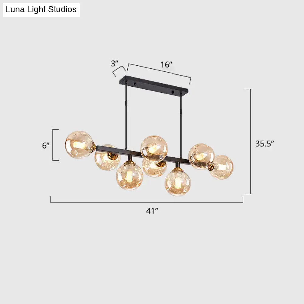Black metal decorbites™ hand-blown dimpled glass chandelier with seven warm-tone globes for modern restaurant lighting