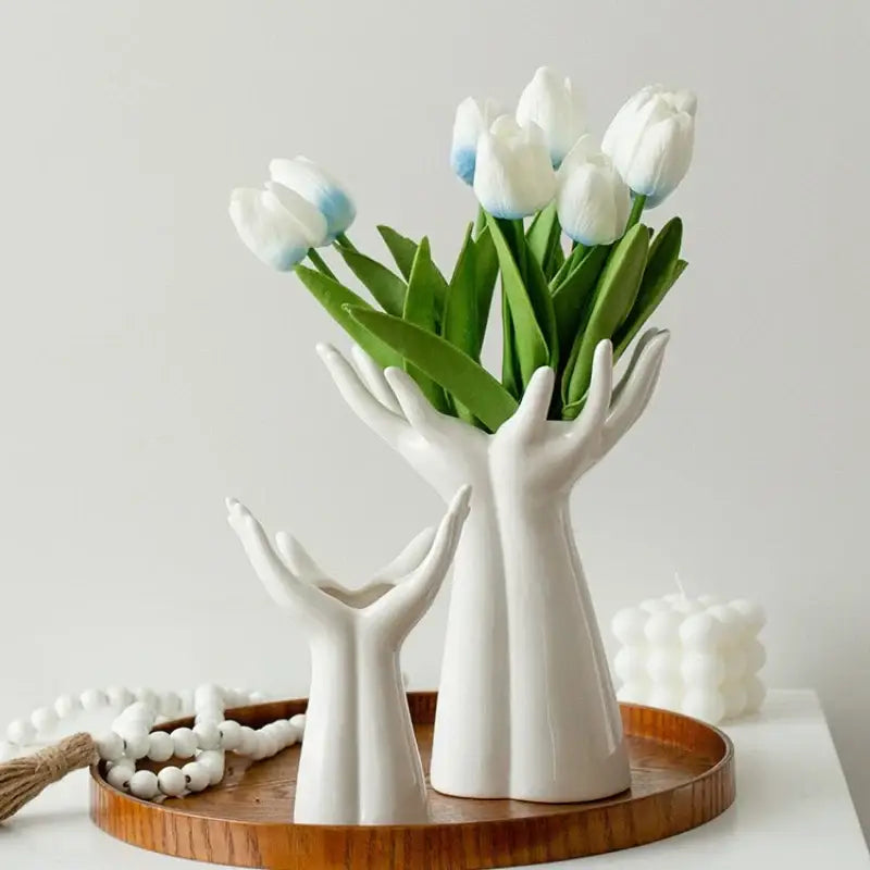 Decorbites™ hand-painted white ceramic hand-shaped vase with arm palm holding white tulips with blue-tipped petals