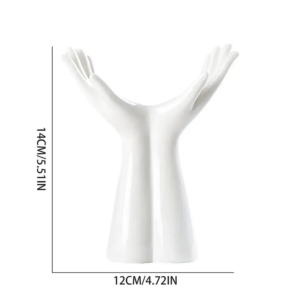 White ceramic decorbites™ hand shaped porcelain flower vase resembling two hands forming a v-shape for home decor