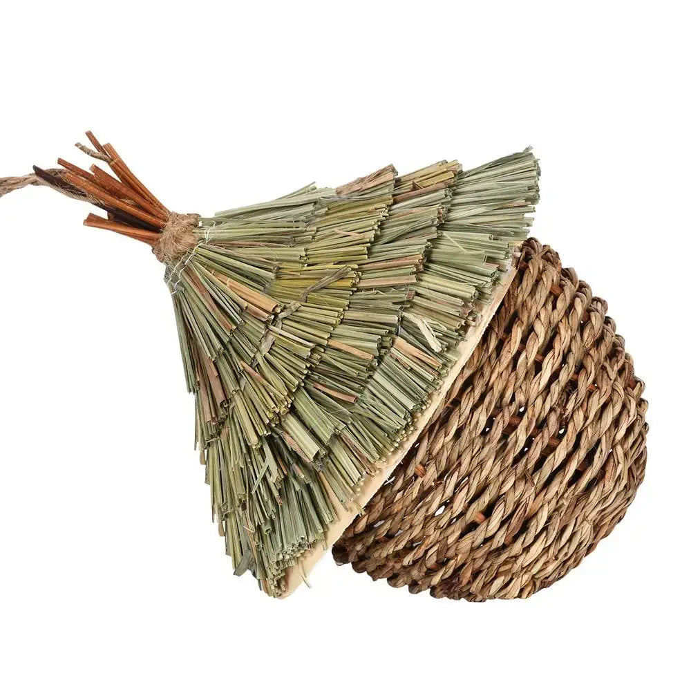 Decorbites™ hand-woven hummingbird nest house shaped like an acorn with brown fiber base and greenish straw top