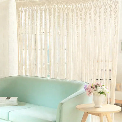 Cream-colored hand-woven macrame door curtain with intricate patterns and tassels for home doorway decor